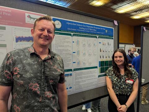 Dr. Fadok poses with Chloe and her poster