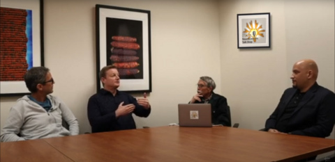 Dr. Fadok describing something with his hands while speaking on the Neuroscientists Talk Shop Podcast
