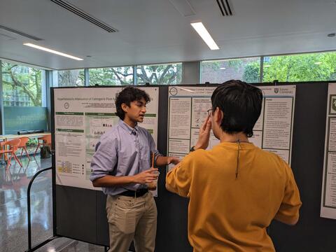 Thamid discussing his work with Eric
