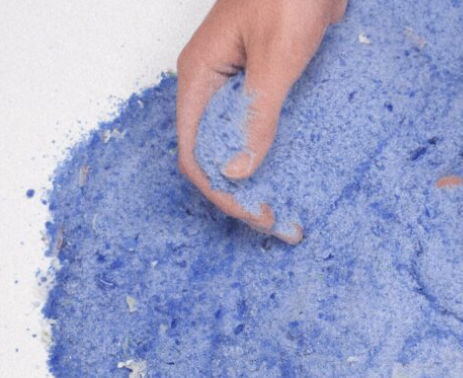 hand in glass sand