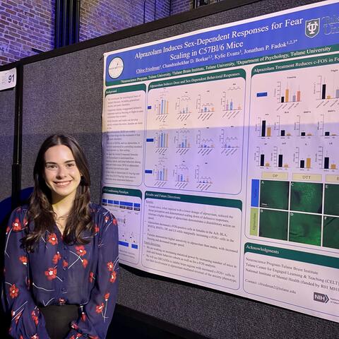 Chloe Friedman standing next to her poster