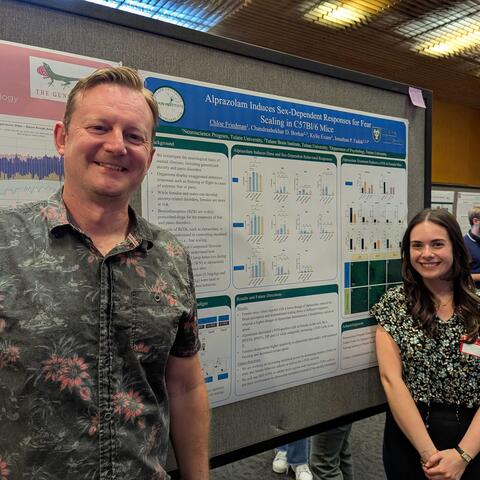 Dr. Fadok poses with Chloe and her poster