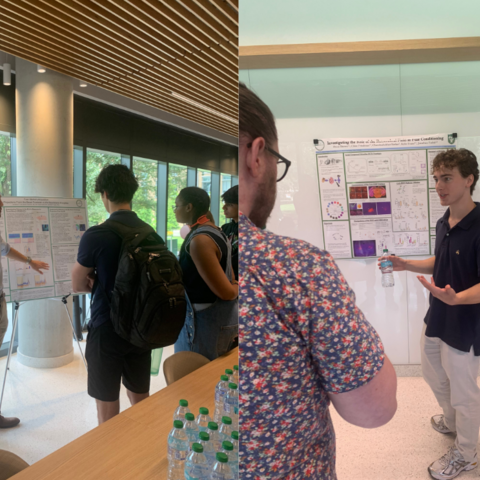 JP Ott (left) and Owen Brown (right) presents their postersto several observers