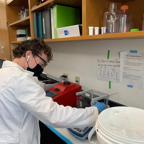 Owen weighs paraformaldehyde to make 6% formalin