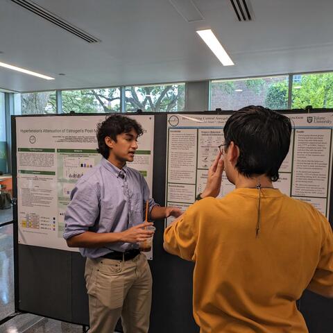 Thamid discussing his work with Eric